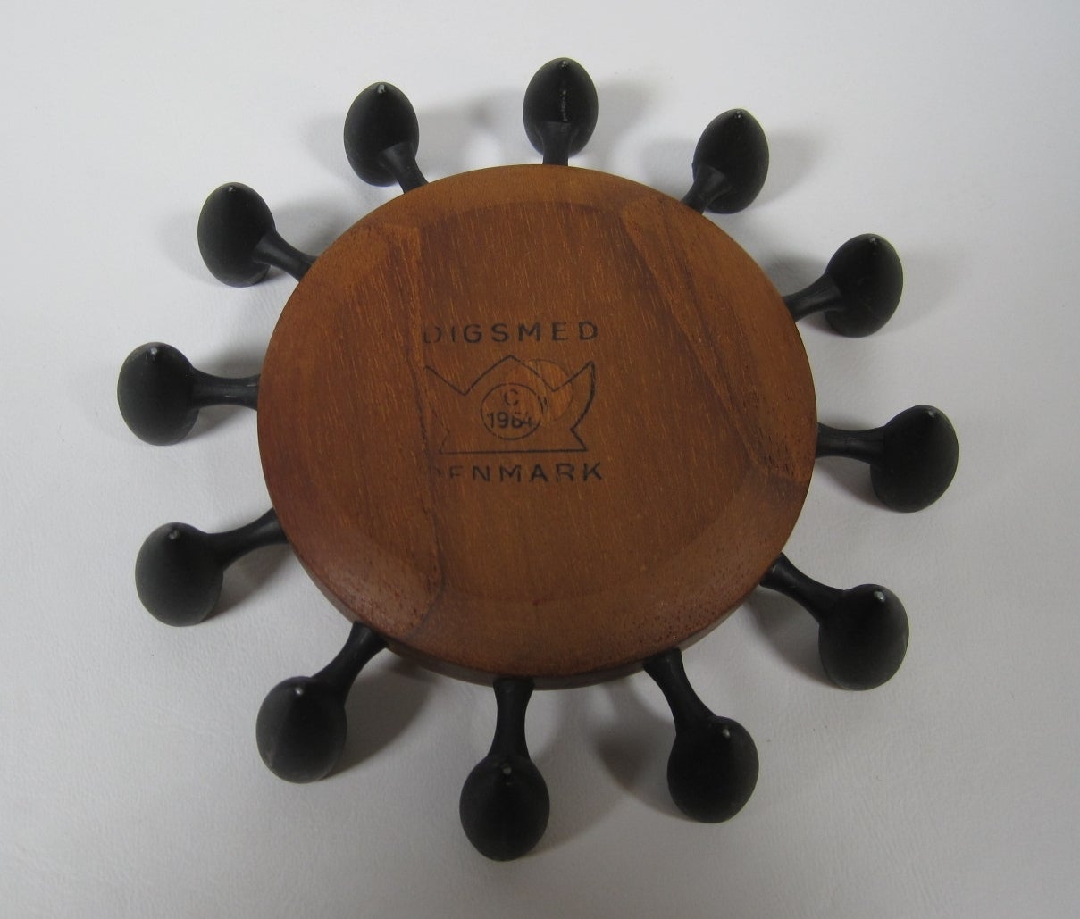 Danish teak Mid-Century Modern candleholder by Digsmed.
Teakwood and torpedo shaped cast iron candlesticks which holds 12 candles.

Free shipping within the United States and Canada.
