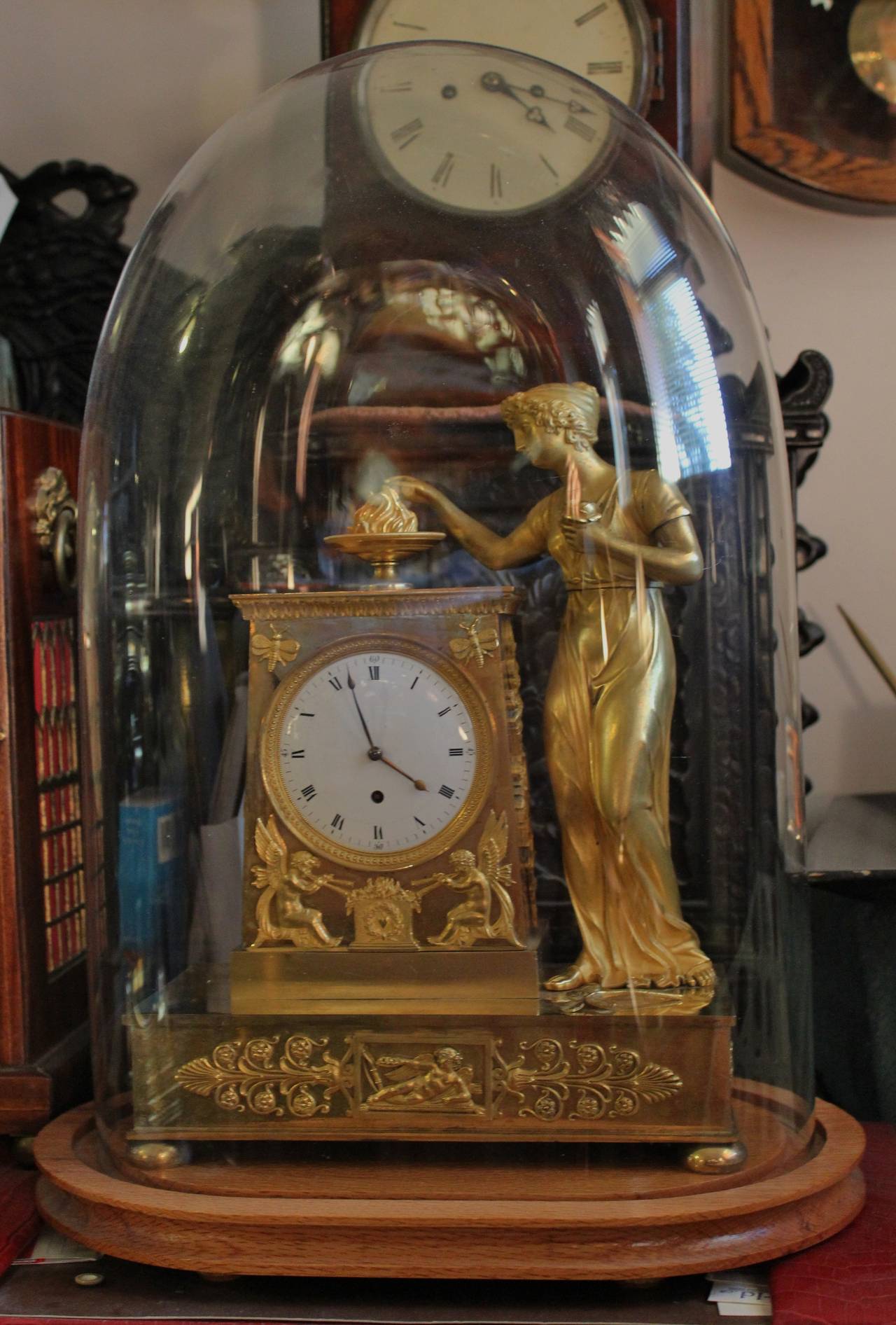 Early 19th century French Empire period gilt bronze figural clock.

Free shipping within the United States and Canada.