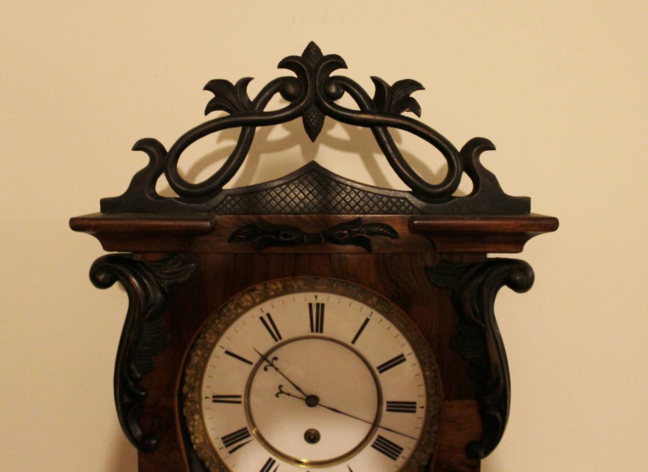 19th century Vienna Regulator wall clock.

One weight Vienna Regulator with ornate carved head piece.