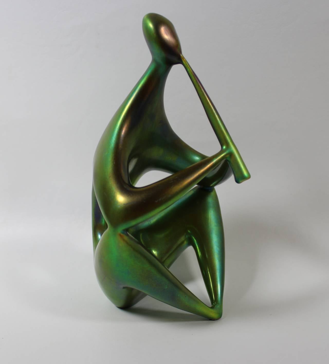 Zsolnay Ceramic Figurine, Mid-Century Modern

Signed Zsolnay Ceramic Flute Player in Eosin glaze.