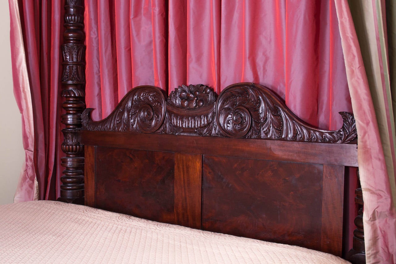 In the Manner of Anthony G. Quervelle
Philadelphia, c. 1830

The tester top rails supported on four elaborately carved posts with a highly carved, shaped and paneled headboard, raised on turned, tapering legs, terminating in massive original