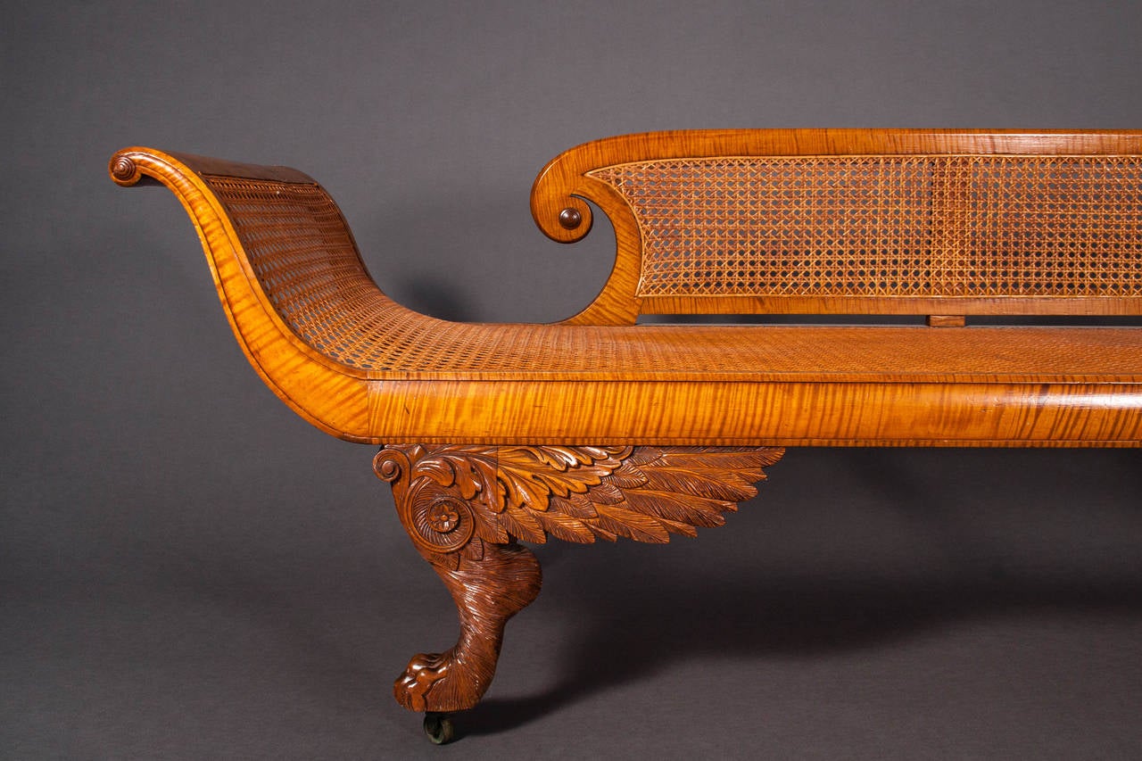 New York, 1815-1825.

The two-thirds back with scrolled arm rest with a tiered concentric boss between scrolled arms each with tiered concentric bosses, the seat rail above 