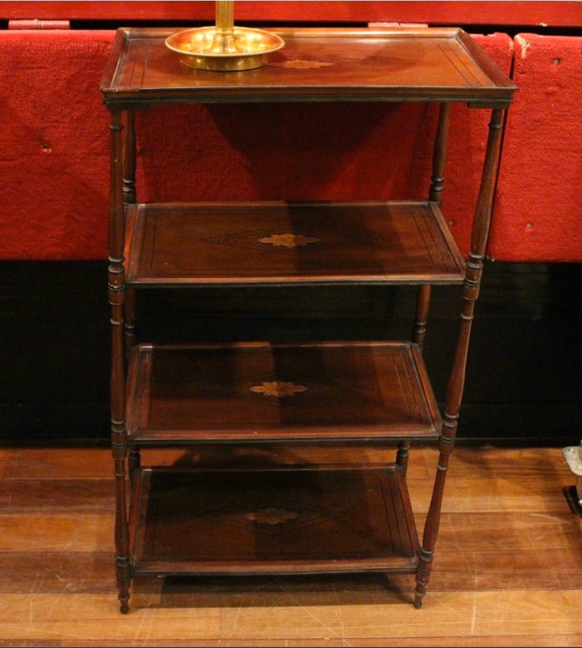 Mahogany pair of four shelf dessert tables.
Each shelf is decorated with double ebony nets close to the corners and, in the middle, with star-spangled roses.