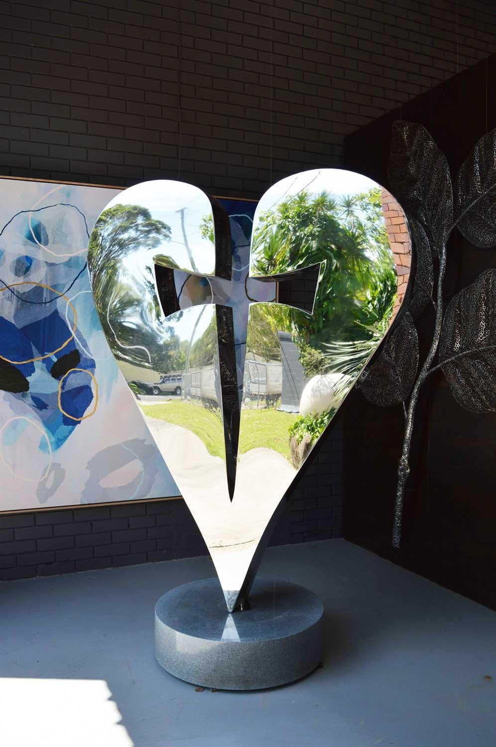 Constructed from stainless steel polished to a mirror-finish, and sitting upon a solid granite plinth, this heart and dagger symbolises the dichotomy of love and hate.
It is able to be turned within it's fitting to find it's perfect angle.
The
