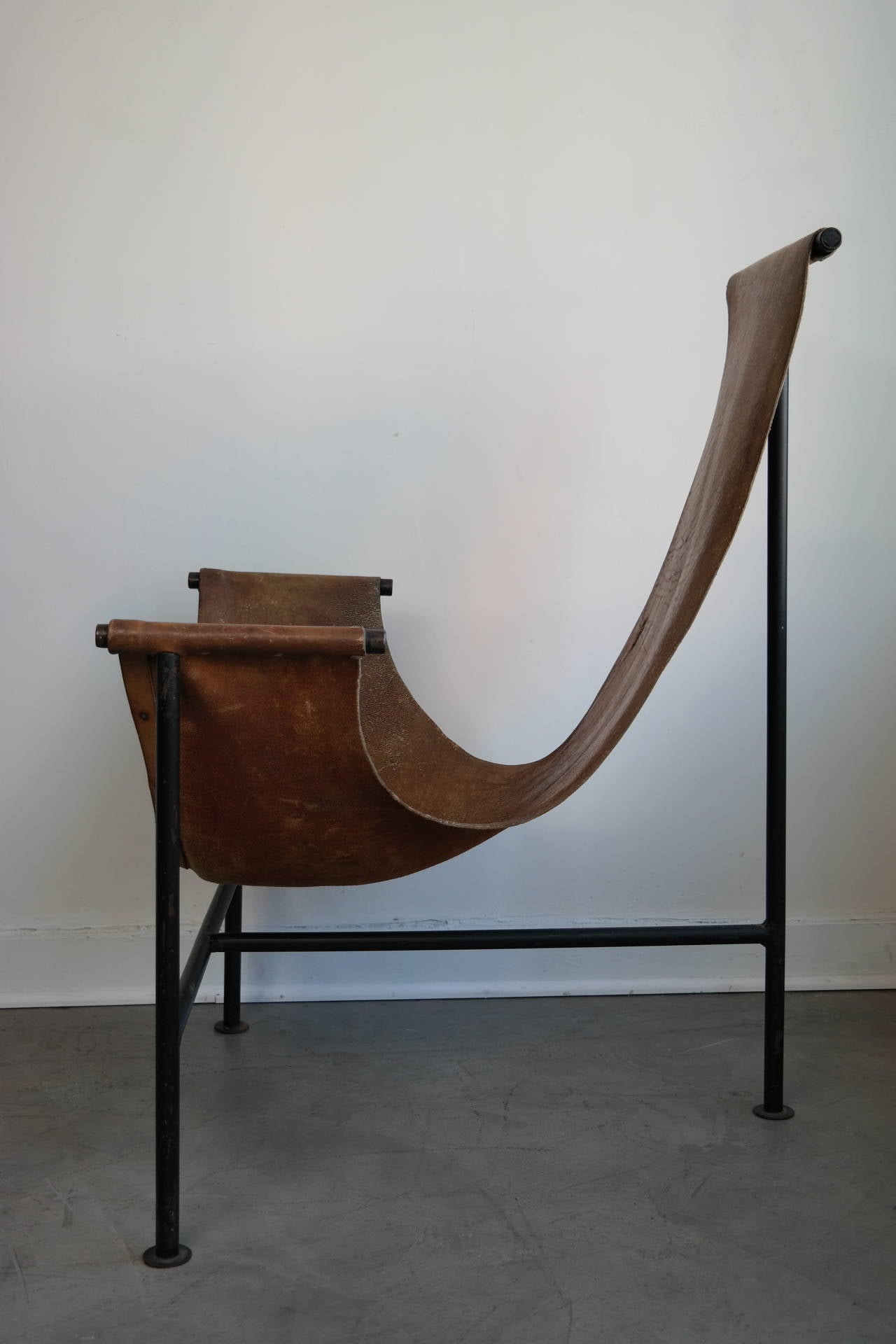This exceptional sling chair is an early copy of a ''T'' chair by Katavolos, after much research we found a possible attribution to Giorgio Belloli, Marfil Guanajuato, 1940s. Mexican Modernism at its best. Leather shows great patina with the