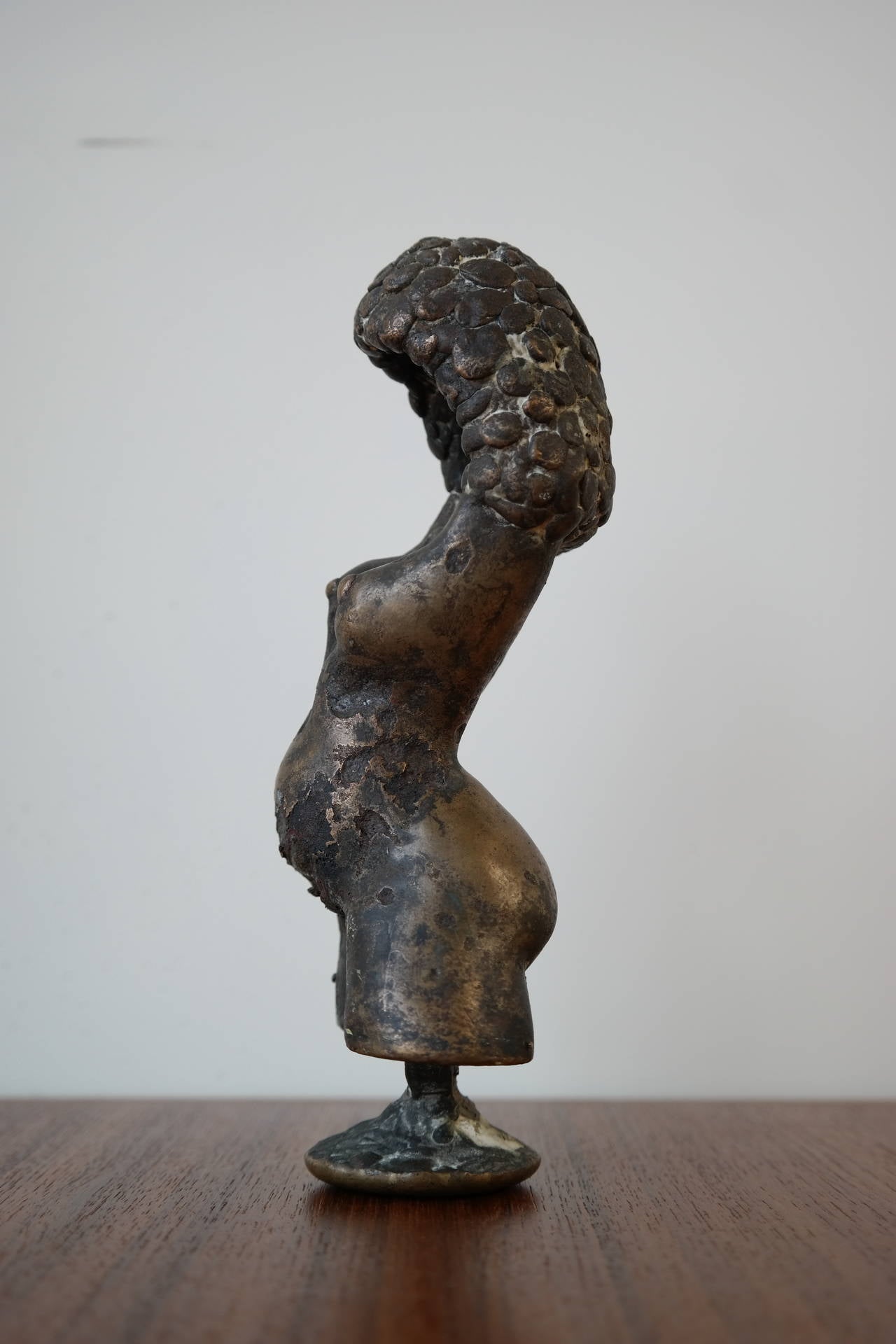 Very impressive small-scale bronze sculpture of a female form. Wonderful details. Signed on underside but unable to find information on artist. Heavy and well made. Brutalist form with great patina.