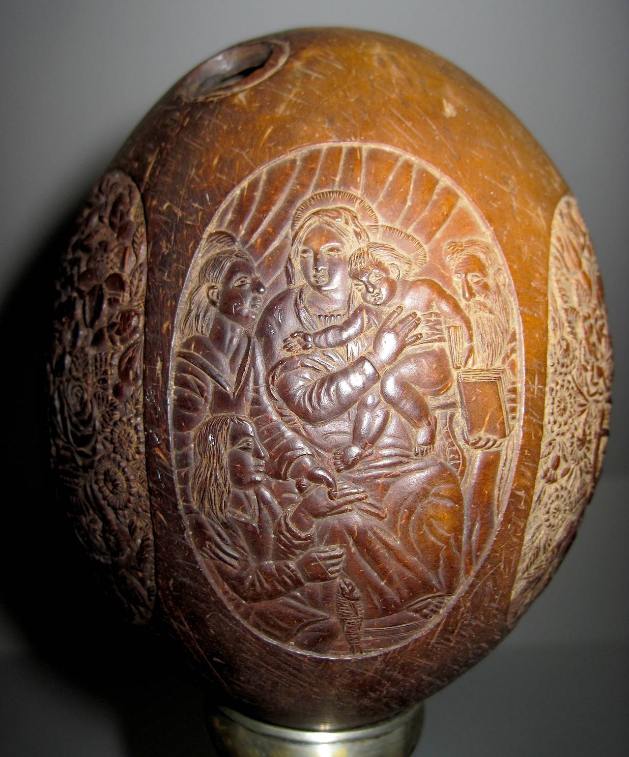 This rare and unusual object is a hand-carved coconut done in the Indian city of Goa, during the era of Portuguese colonization. The workmanship of the exquisite carving is superb in every way and shows the highest level of skill. In Goa, evidence