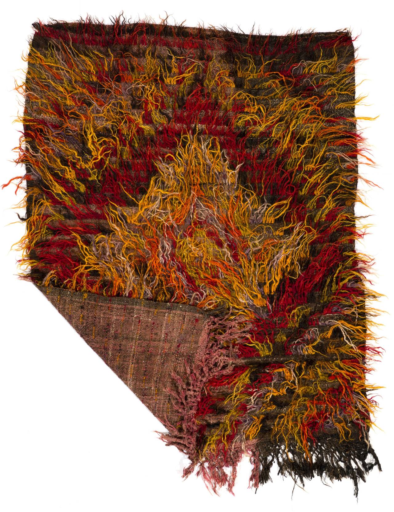 This vintage handmade rug is called "Flikli" in Turkey which is a word for a "flokati" style shag pile (Tulu) handmade rugs produced for daily use by Nomads in Central Anatolia. 

This particular one is made of tufts of local