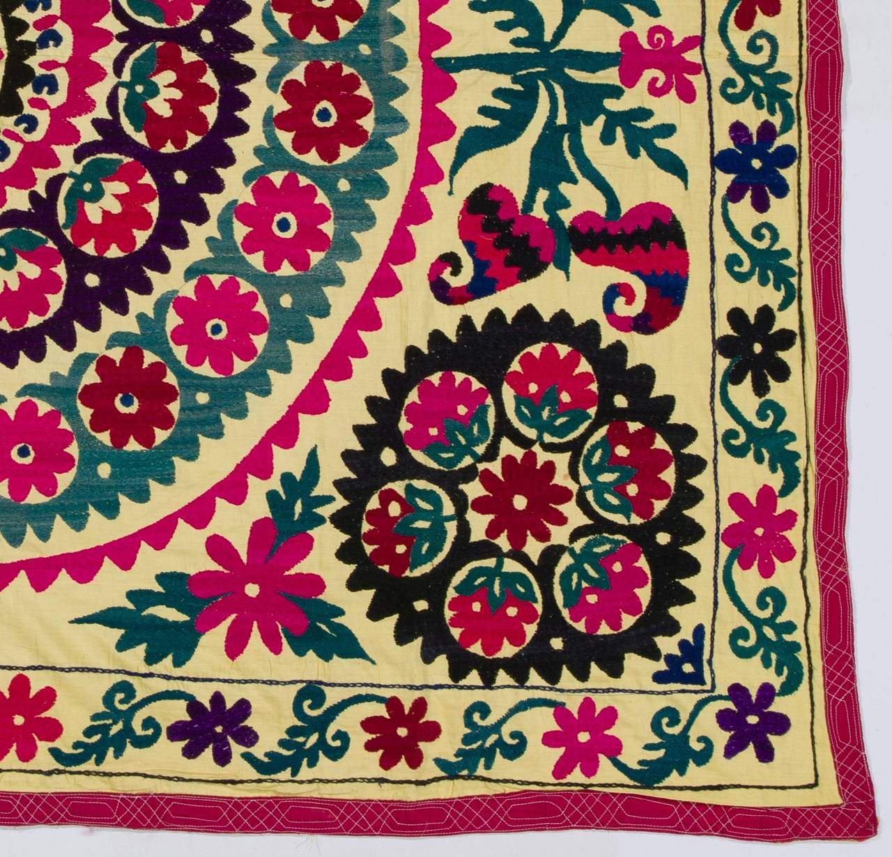 A vintage decorative handmade needlework from Uzbekistan in Central Asia. This fine cotton embroidery with silk highlights can be used in various ways such as a wall-hanging, a bed or table cover or as sofa throw.