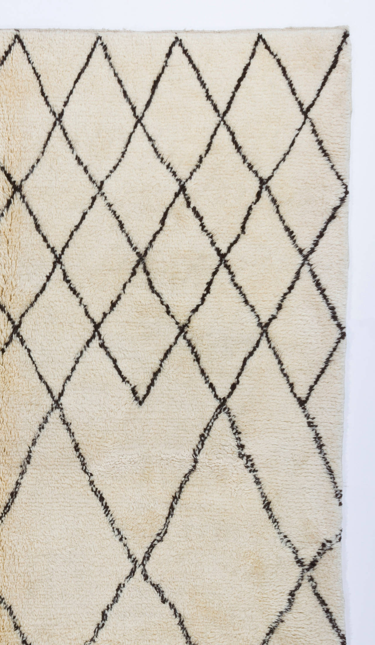 A contemporary handmade Moroccan rug with thick soft pile, made of natural undyed ivory/cream and brown wool. Available as it is or can be custom produced in any size and color combination requested.
