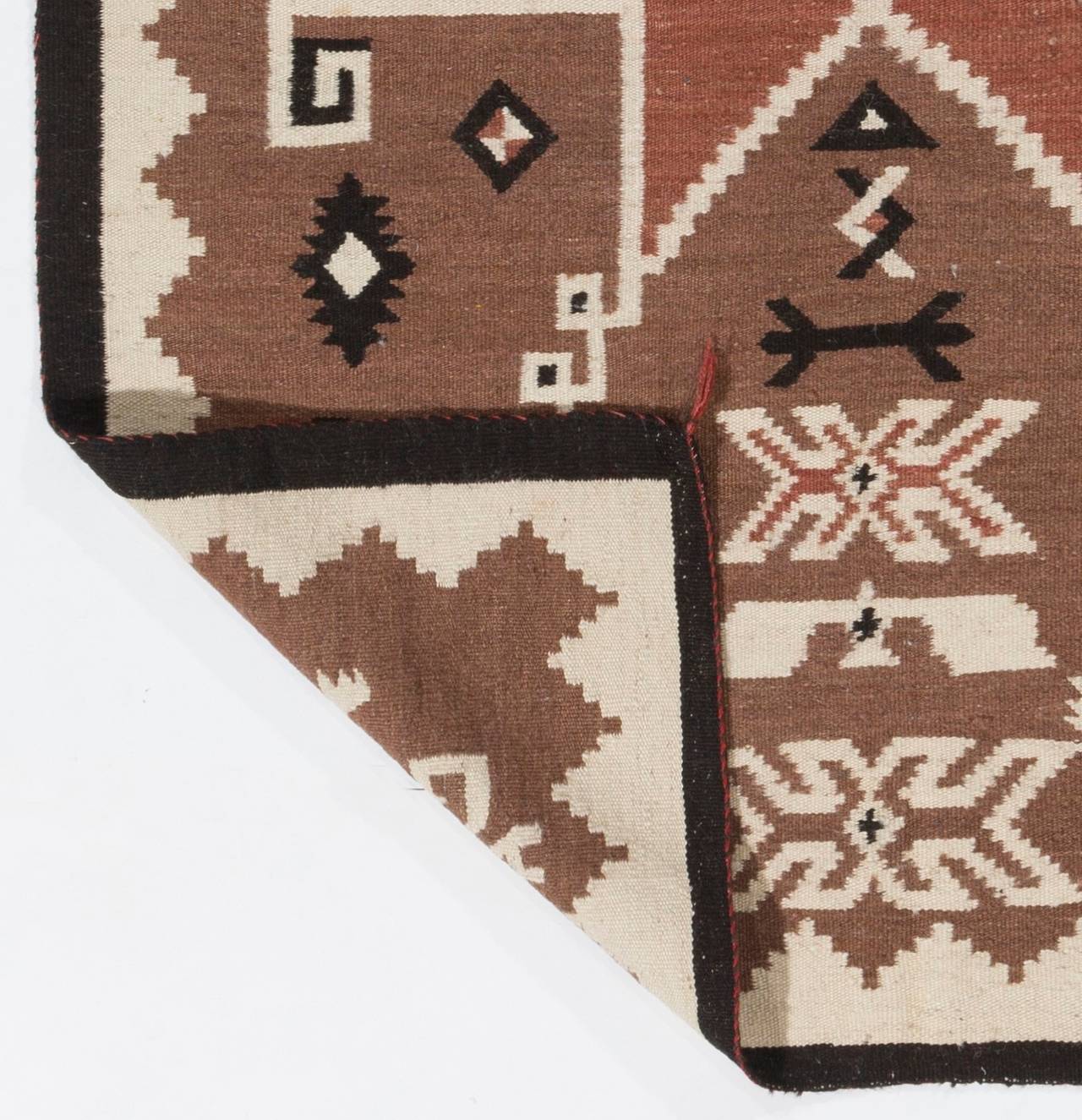 A vintage Navajo handwoven storm pattern rug. Measures: 4' x 6' ft, all wool.