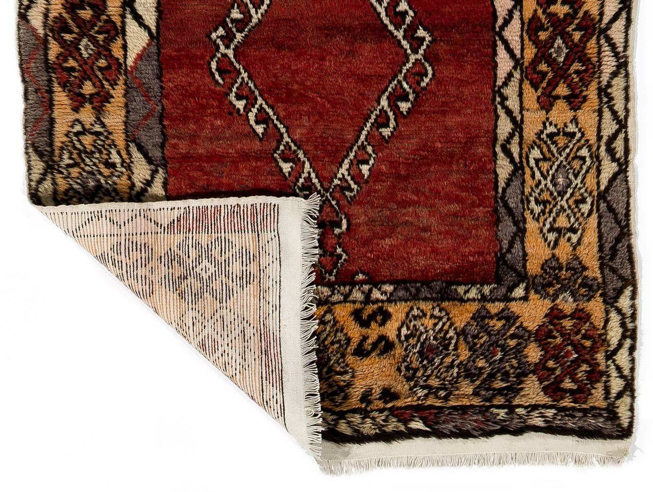 An archaic and unique antique hand-knotted rug produced by the nomads in Central Anatolia by the turn of the century for their daily use rather than re-sale purpose. Lustrous wool pile on cotton foundation and well preserved original condition.