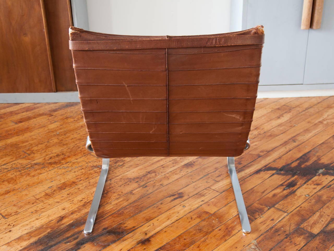 Leather and chrome-plated steel PK-20 chair by Poul Kjærholm, manufactured by E. Kold Christensen, Denmark. Unlike many of his Scandinavian contemporaries whose main focus was wood, Kjærholm was primarily interested in exploring steel for its