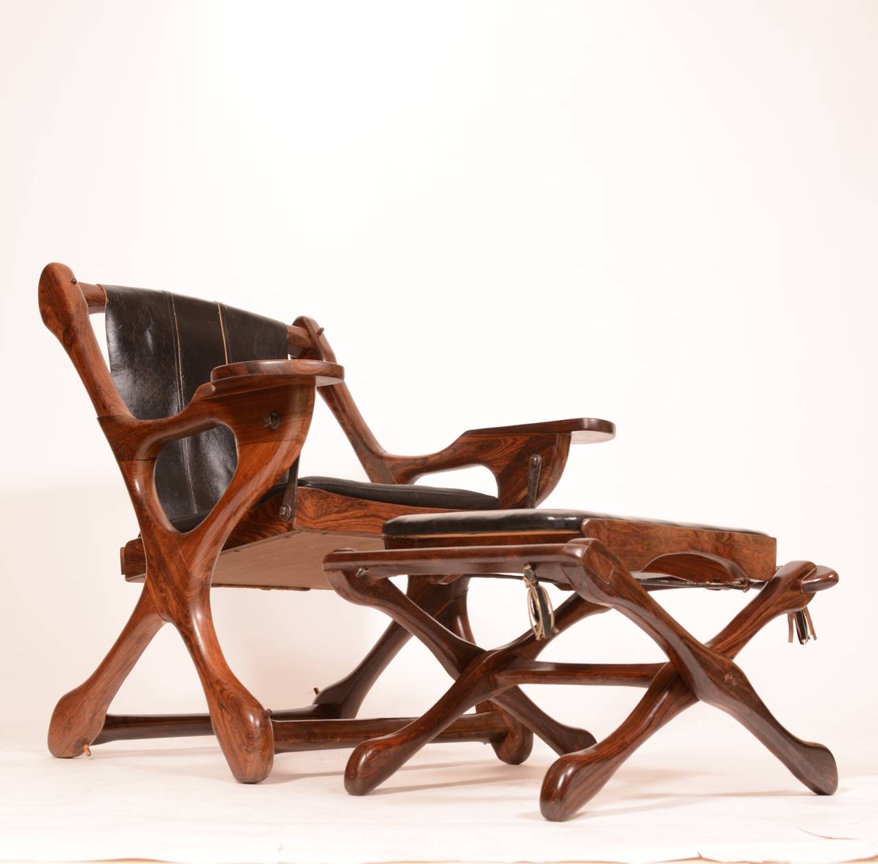 Don Shoemaker Cocobolo rosewood Sling Swinger chair and ottoman. Original finish and leather in great condition. Seat leather has been replaced. Retains the Senal Studio Labels.