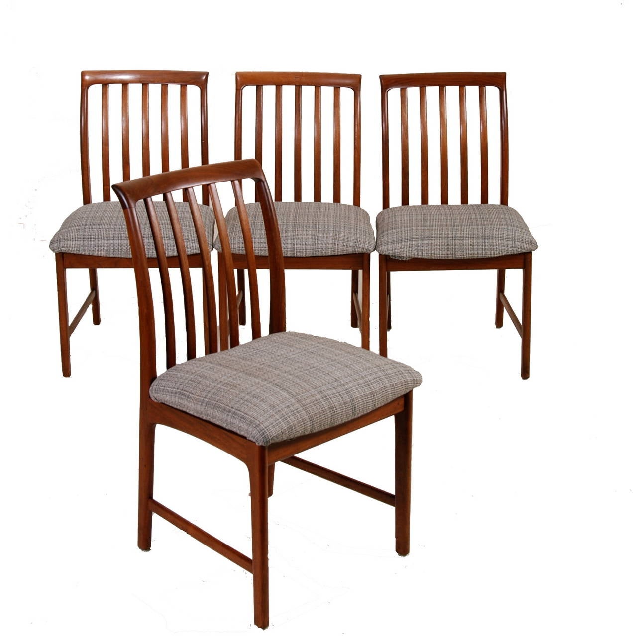 Set of four modern walnut dining chairs by Folke Ohlsson for Dux in great vintage condition with new upholstery.