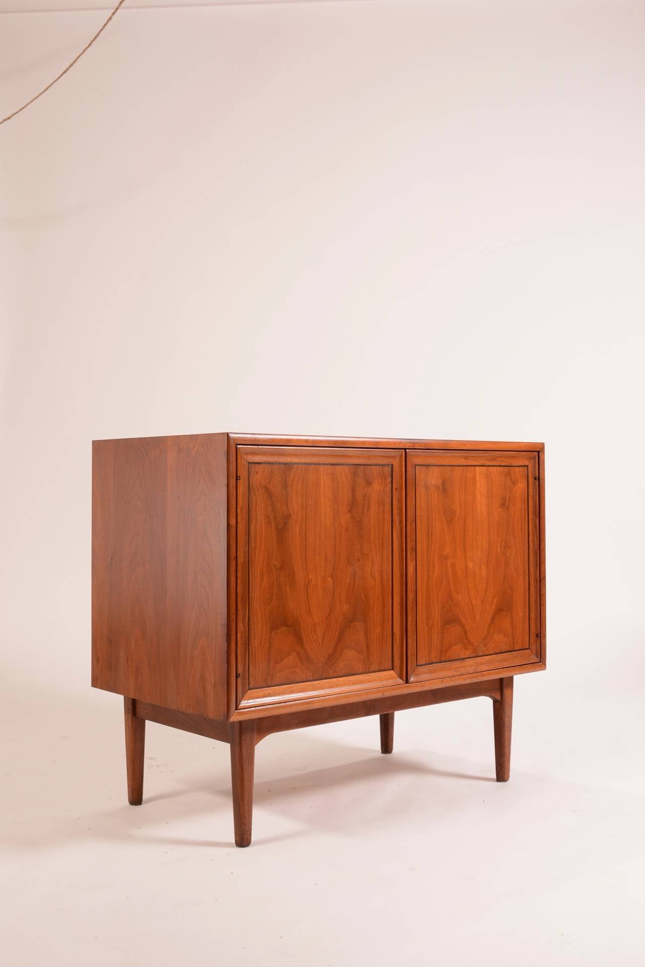 This is a beautiful walnut mid century modern credenza designed by Kipp Stewart and Stewart Macdougall for the Drexel Declaration line. This piece has its original finish and is in good condition with age appropriate wear.