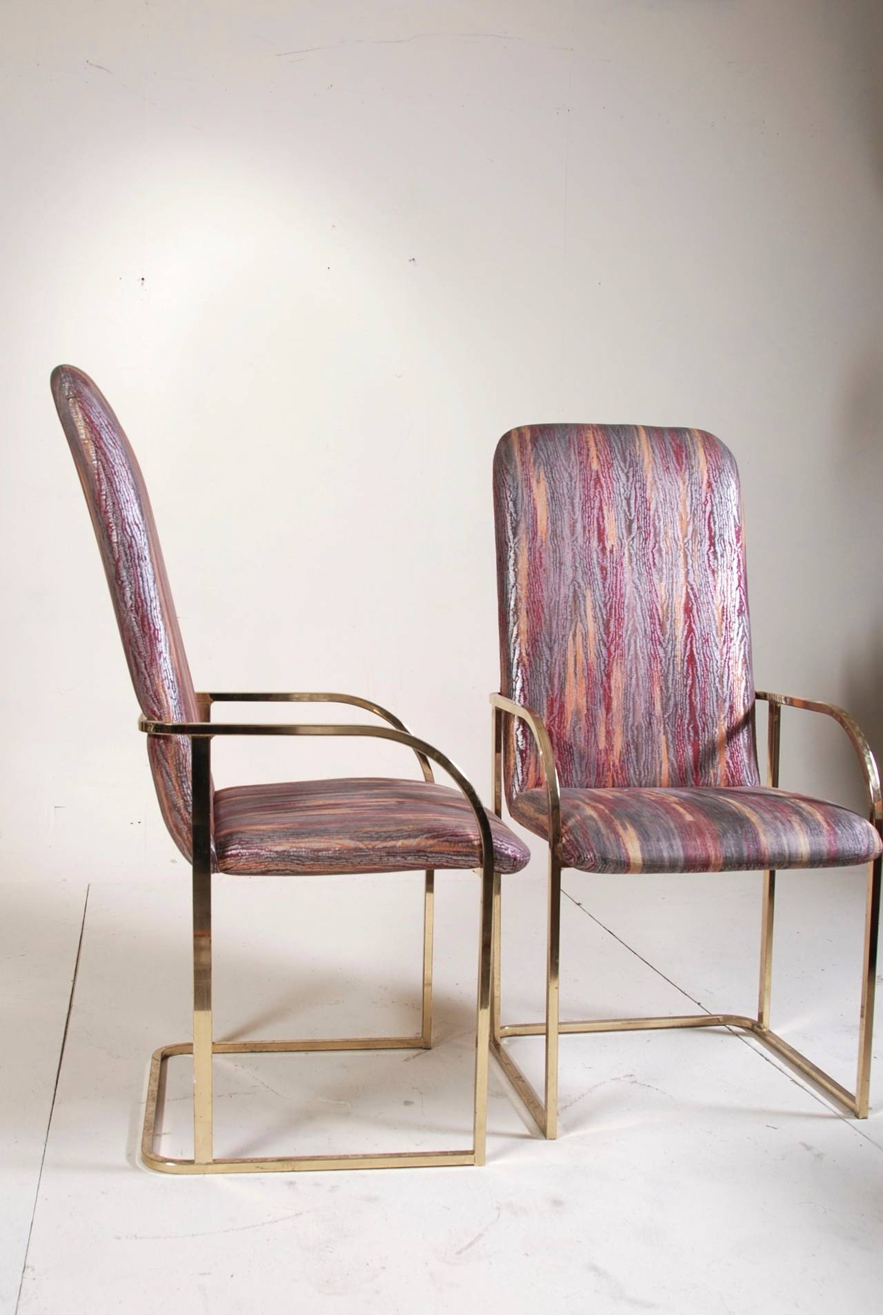 A pair of Milo Baughman dining chairs for DIA. These chairs are in good vintage condition with age appropriate wear.