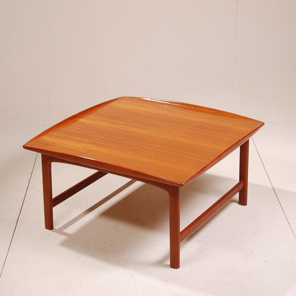 A pair of teak Mid-Century Modern tables designed by Folke Ohlsson and made by DUX. Each table is in great condition and is marked on the bottom.