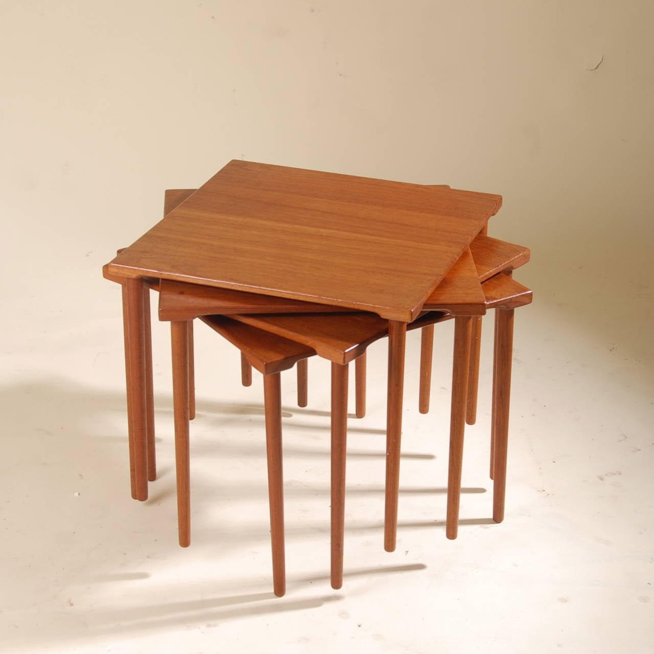 This is a set of 4 Peter Hvidt for France & Daverkosen teak end tables in great vintage condition. They are solid teak, no veneer.  Price is for 2 tables.

