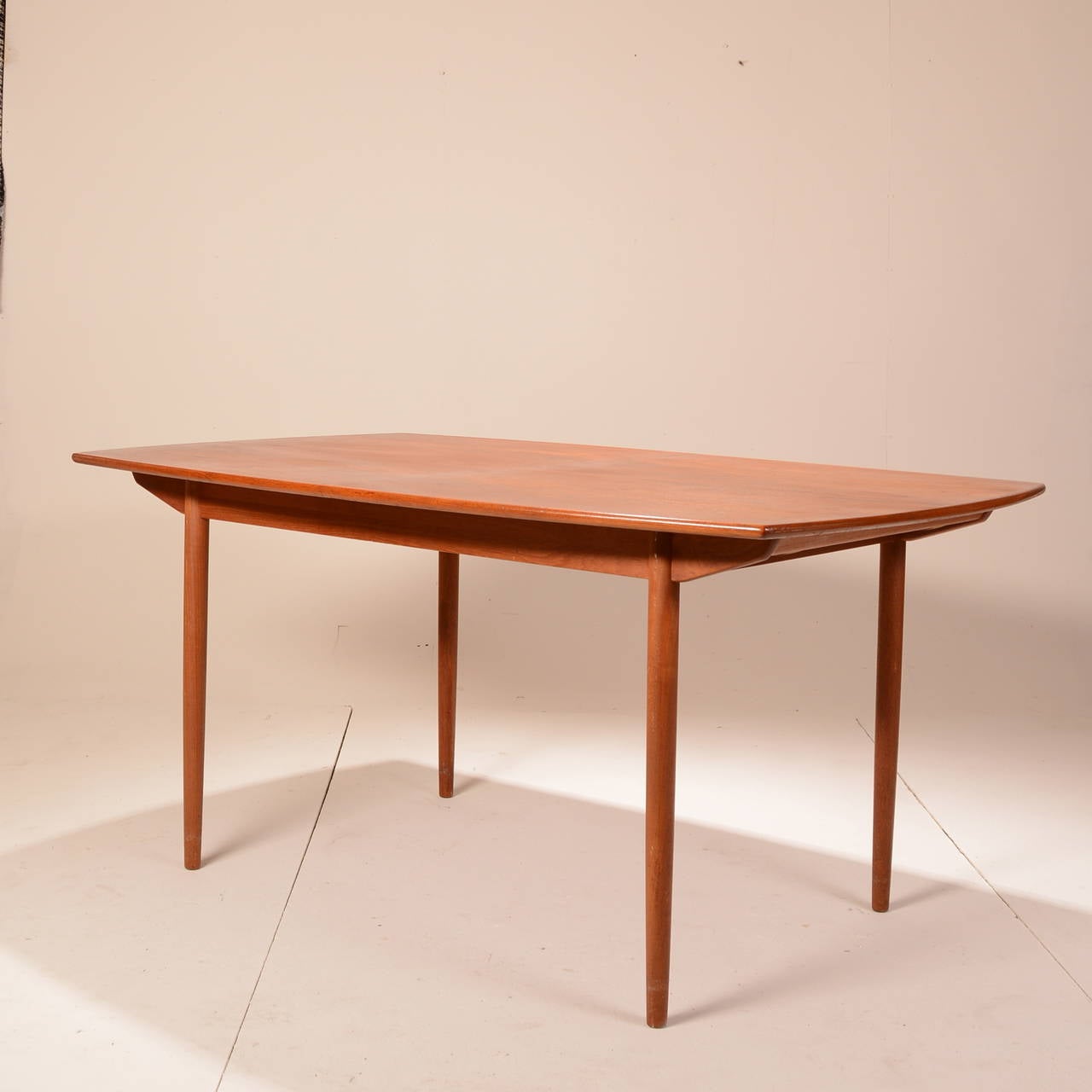 This is a gorgeous teak mid century dining table with three 12