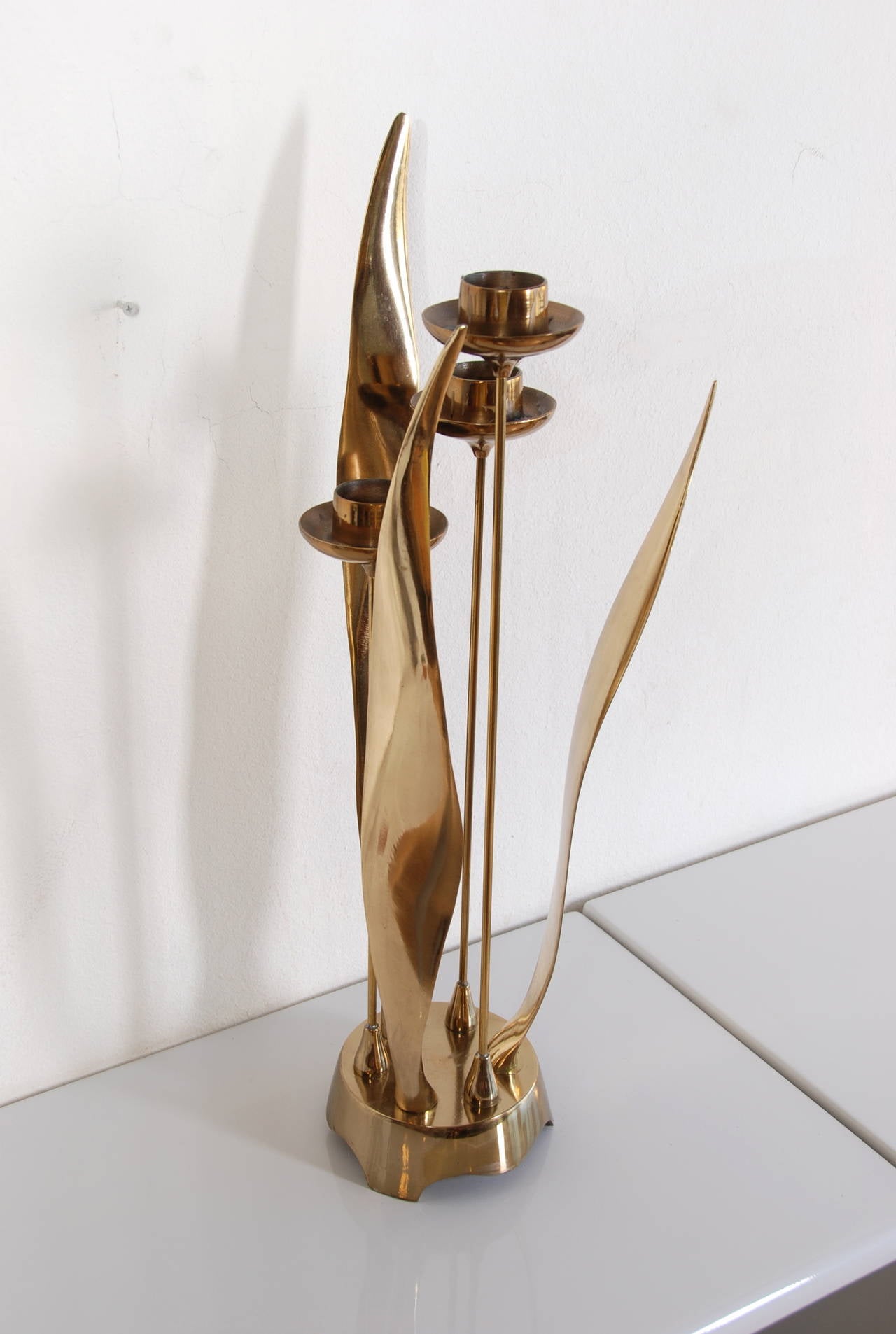 This is a beautiful mid century brass candle holder in brass.  Very heavy! 