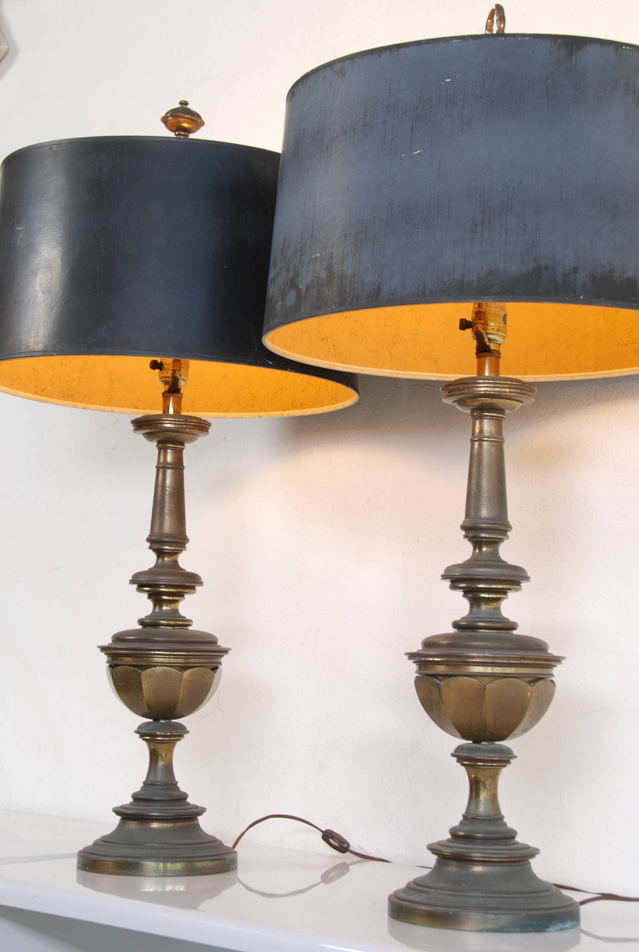 This is a great pair of mid century Stiffel Lamps with the original shades. Stiffel sticker on the lamps and stamped into shade armature. Price is for the pair.
35