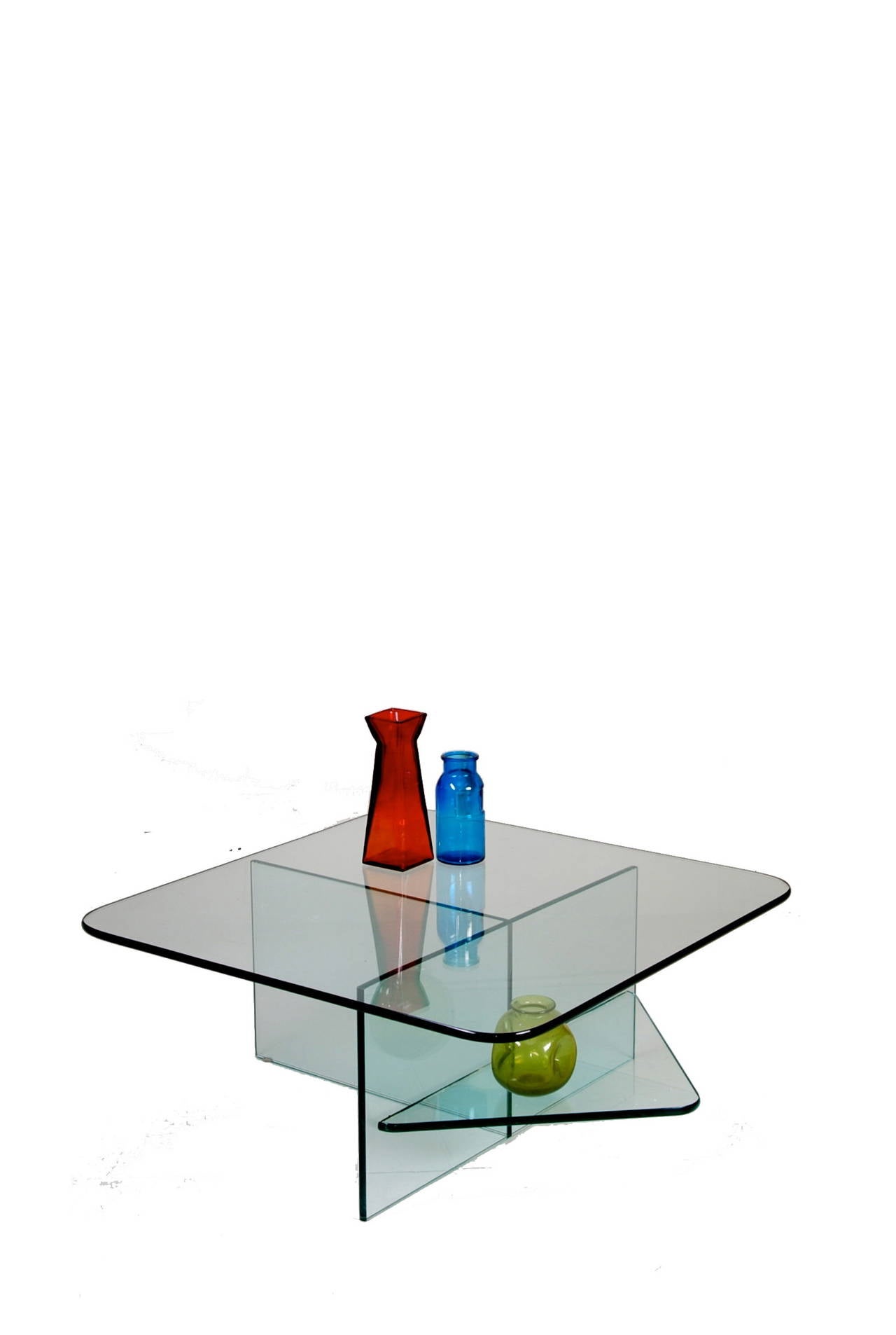 This is an amazing modern glass table in the Memphis design school style. This piece is in great vintage condition with light wear and one chip repair.