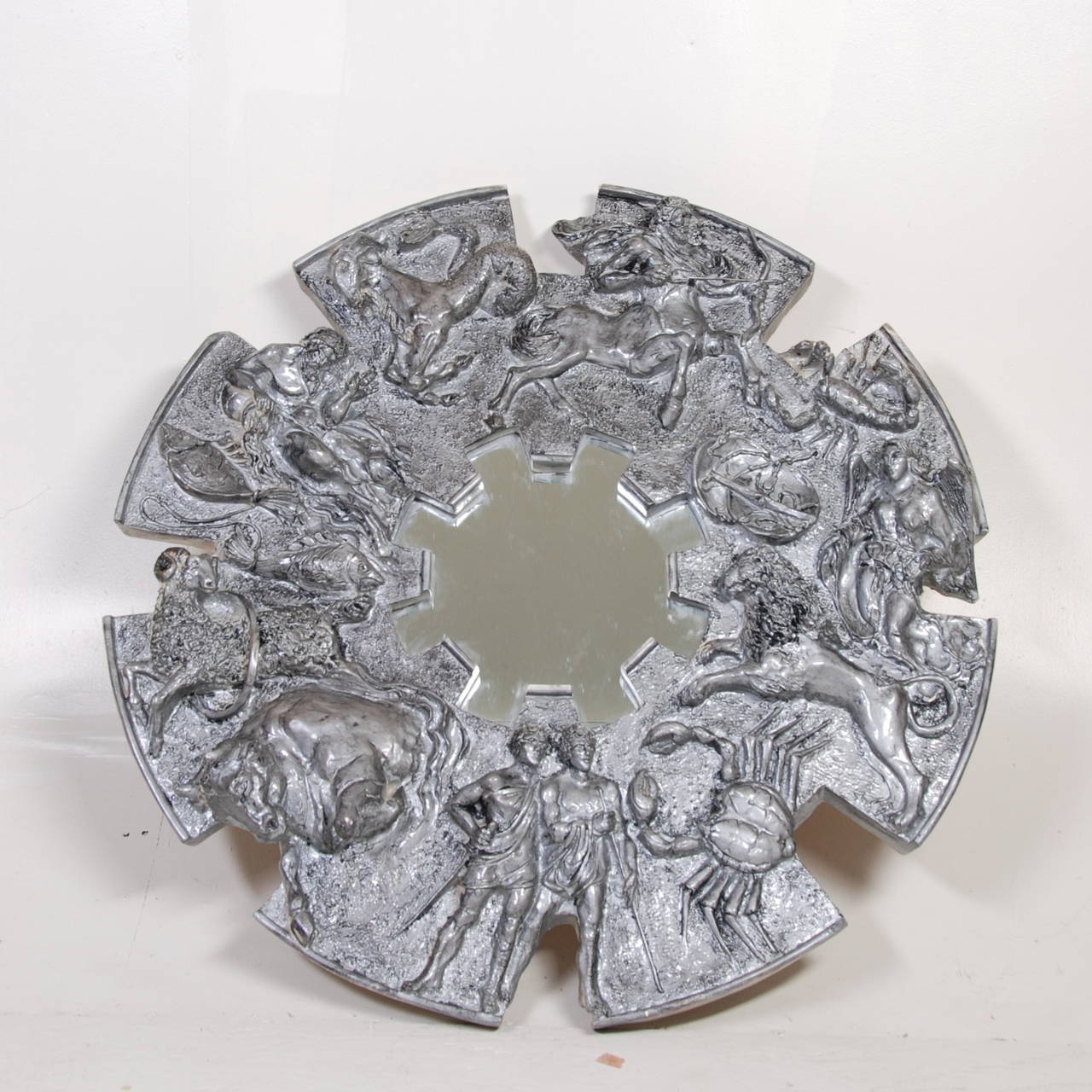 Brutalist zodiac mirror by Finesse Originals, circa 1970.  Cast resin with a custom silver finish.