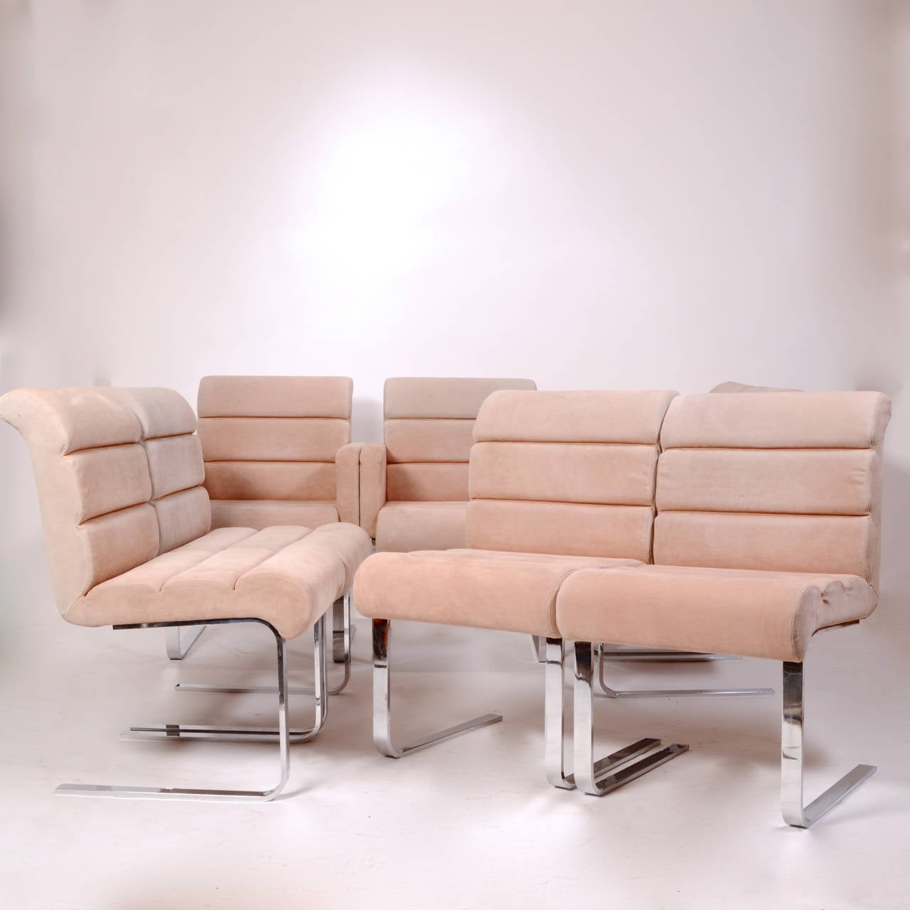Set of 8 Lugano cantilever dining chairs, made in Italy by Mariani for Pace Collection, circa 1970s. Polished chrome steel and original suede upholstery.
