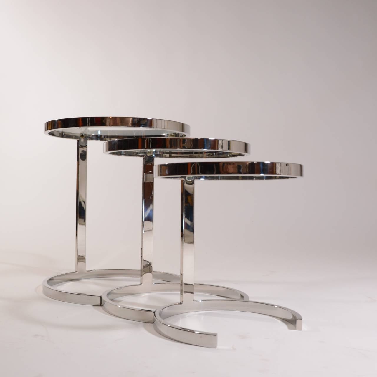 Polished Set of 3 Nesting Stainless Steel and Glass Nesting Tables by Brueton