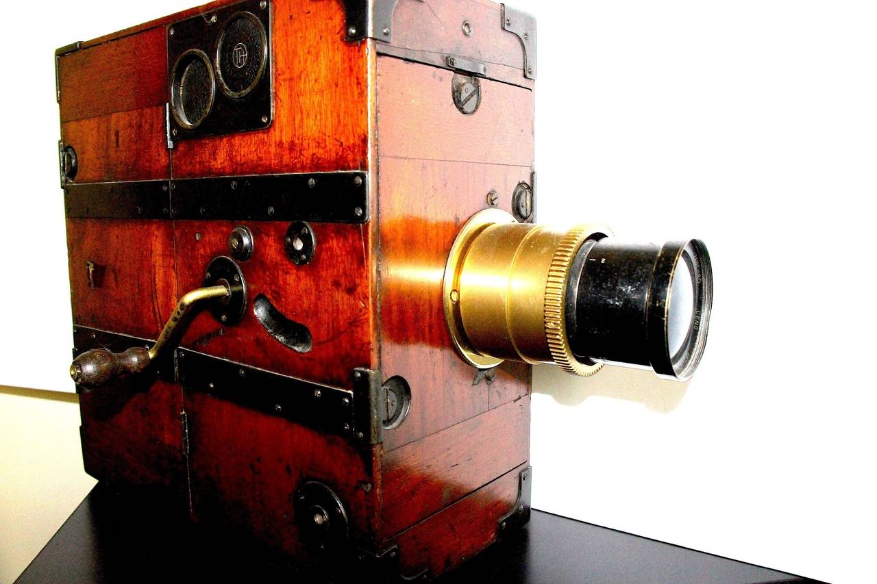 Special 20% reduced price sale for a limited time only.

Submitted for your perusal, an early 20th century hand crank 35mm motion picture camera made by Alfred Darling of Brighton England. It has wonderful original wood patina and is very