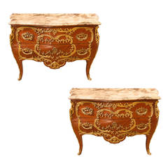 Pair of French Commodes bombe' form with elaborate bronze mounts