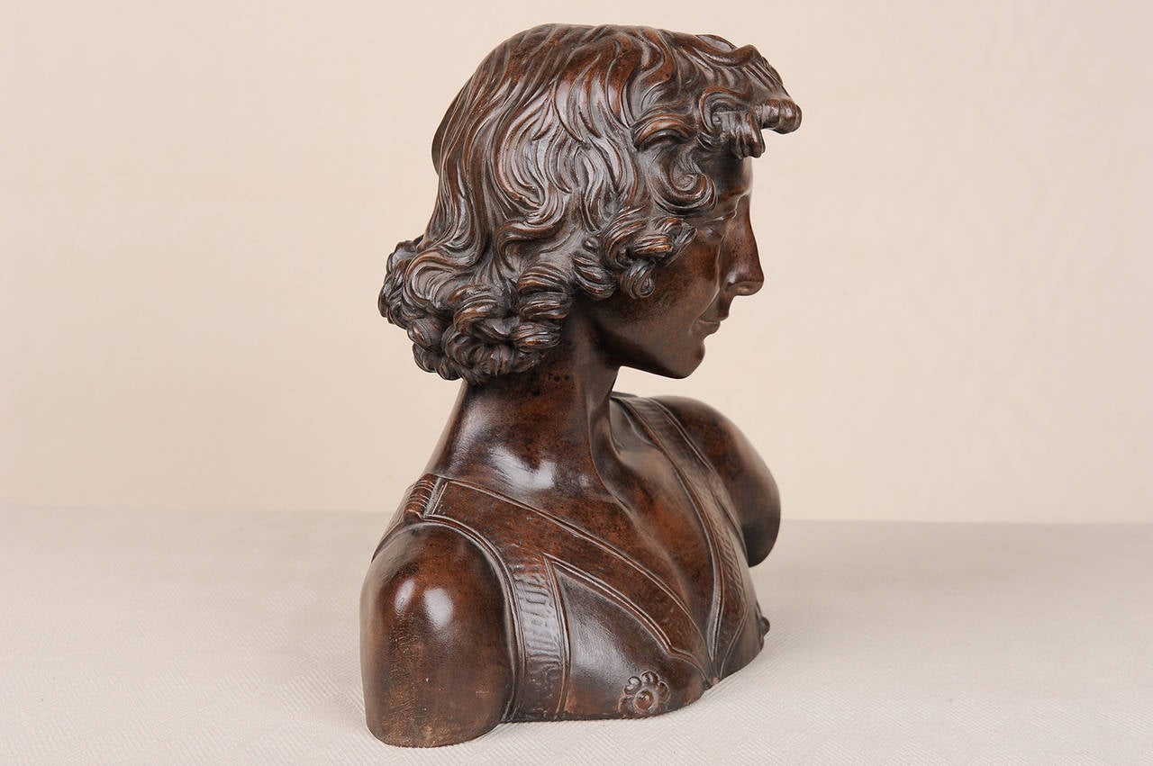 Interesting terracotta bust, imitaion bronze, - French reproduction of the famous ;Davide del Verrocchio (that is in the Museo del Bargello in Florence).
