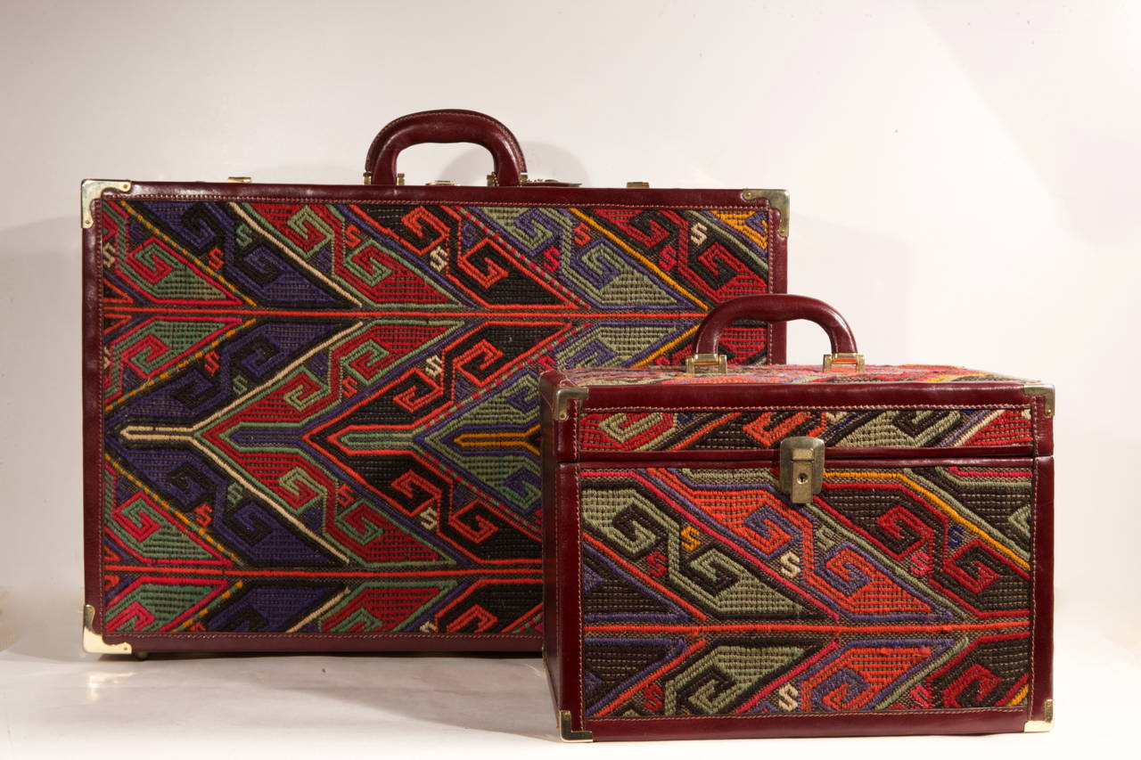 Anatolian Old Cicim manufactured suit-case and beauty-case, with  Italian fine red Bordeaux leather  . They are not recommended by plane, but elegant on Your car.
If you don't use as suit-case, I suggest to place them as side-table or document