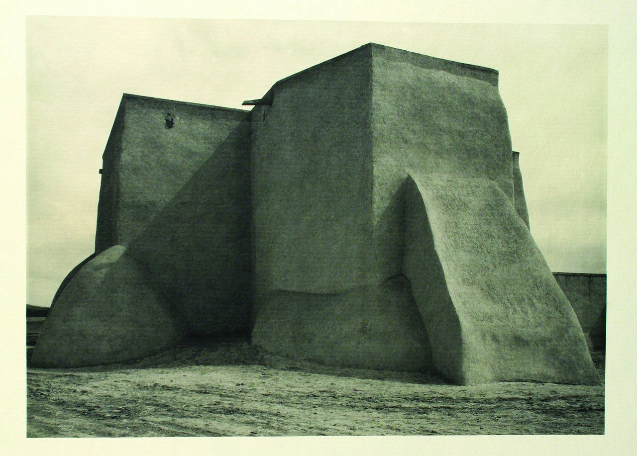 Taos Pueblo with photographs by Ansel Adams. By Mary Austin.  20, [14] pp.  Illustrated with 12 black-and-white photographs by Ansel Adams. Folio, bound in original quarter tan morocco over orange buckram (Hazel Dreis).  San Francisco: Grabhorn
