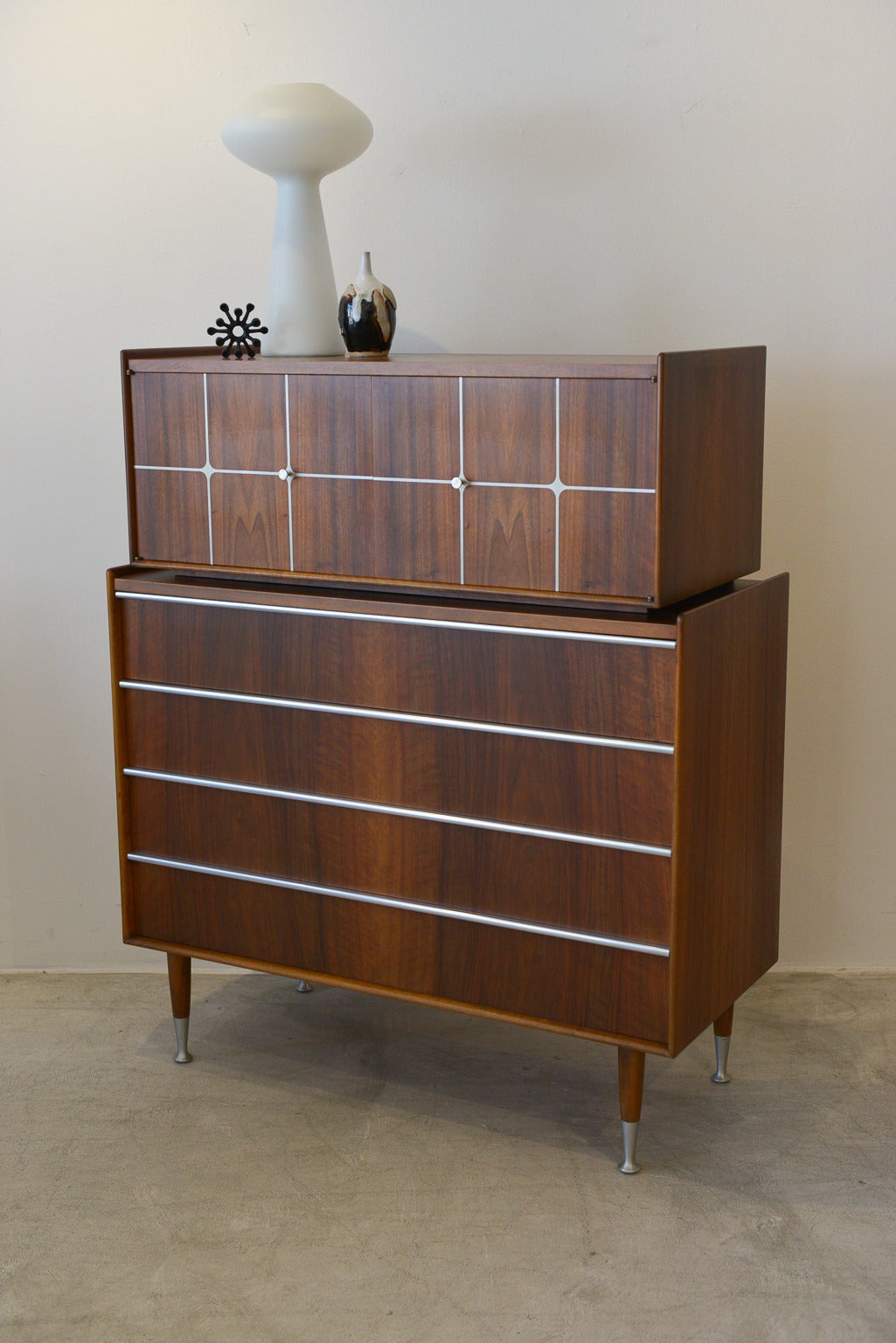 Beautiful and rare walnut with aluminum inlay, leg and drawer detail. Rare, extremely hard to find piece, this beautiful Edmund (Edmond) Spence highboy is made in Sweden, makers mark on the back. This beautiful piece is made of of two pieces, the