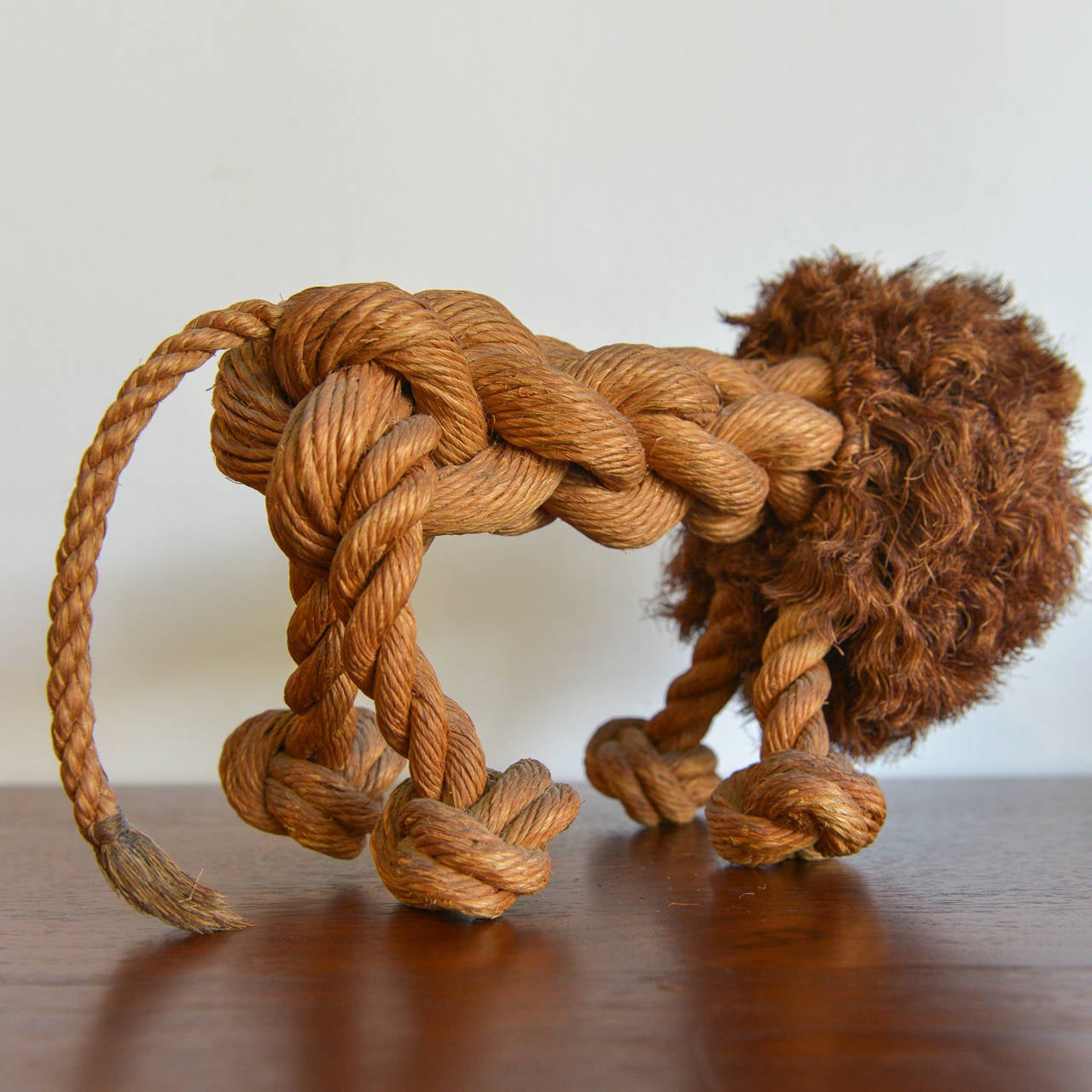 This adorable little rope lion is a pretty rare piece of Danish toy history. Beautifully handcrafted by Jorgen Bloch of Denmark, the rope is made into an adorable lion figure complete with whiskers, mane and a long tail. 100% original, these pieces