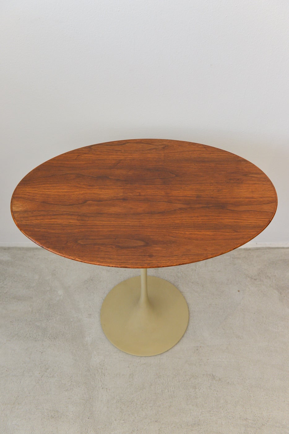 A very early and pristine oval walnut tulip side table with tulip base designed by Eero Saarinen for Knoll. Original top, base has wonderful patina and still retains the very early Knoll ‘bowtie’ label on underside.

A classic and iconic piece of