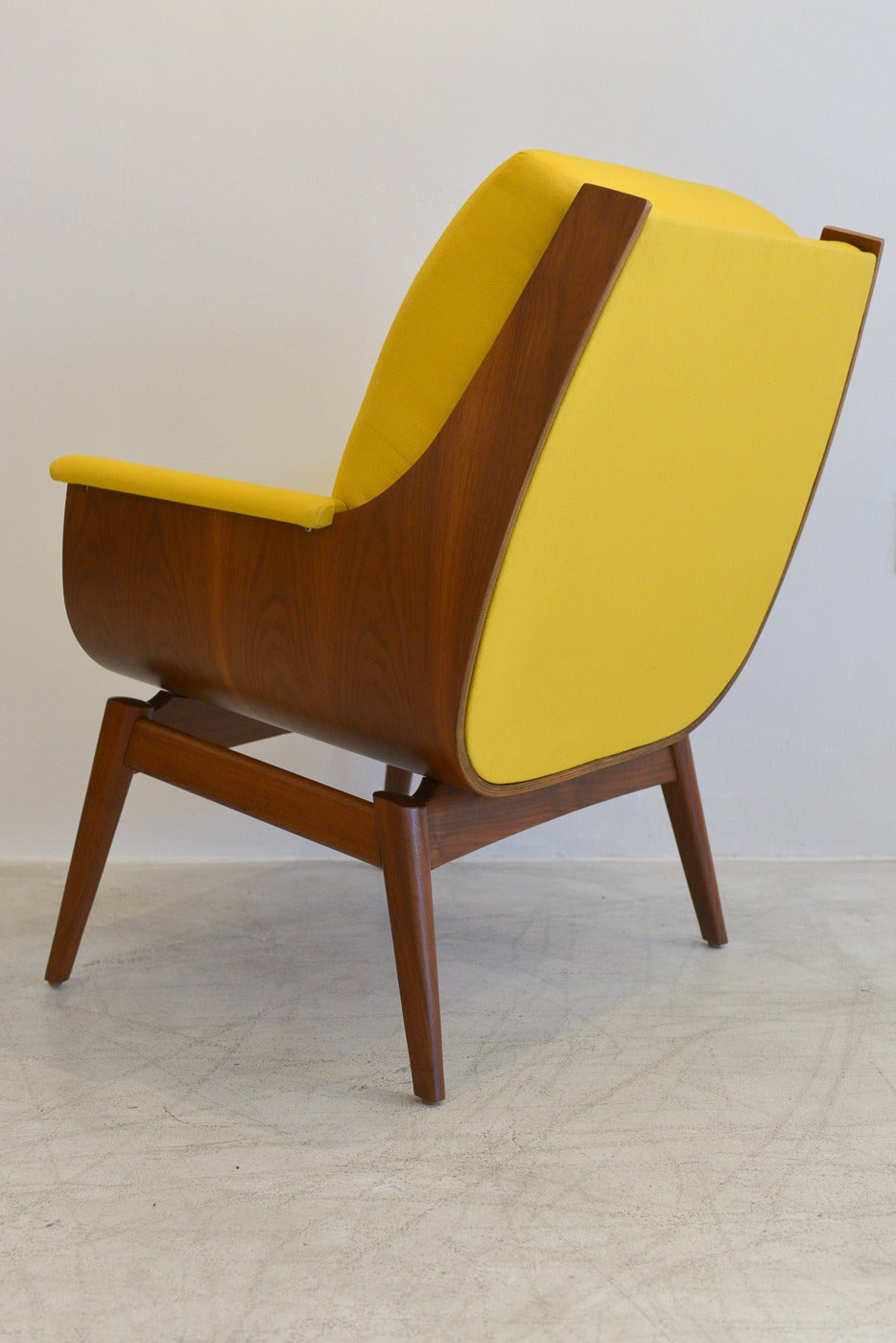Incredibly rare and amazing walnut ply bentwood chair by Kodawood with new bright yellow upholstery and professionally restored wood. Showroom perfect condition, this chair will add a pop of color and fun to any decor. Great unusual clamshell