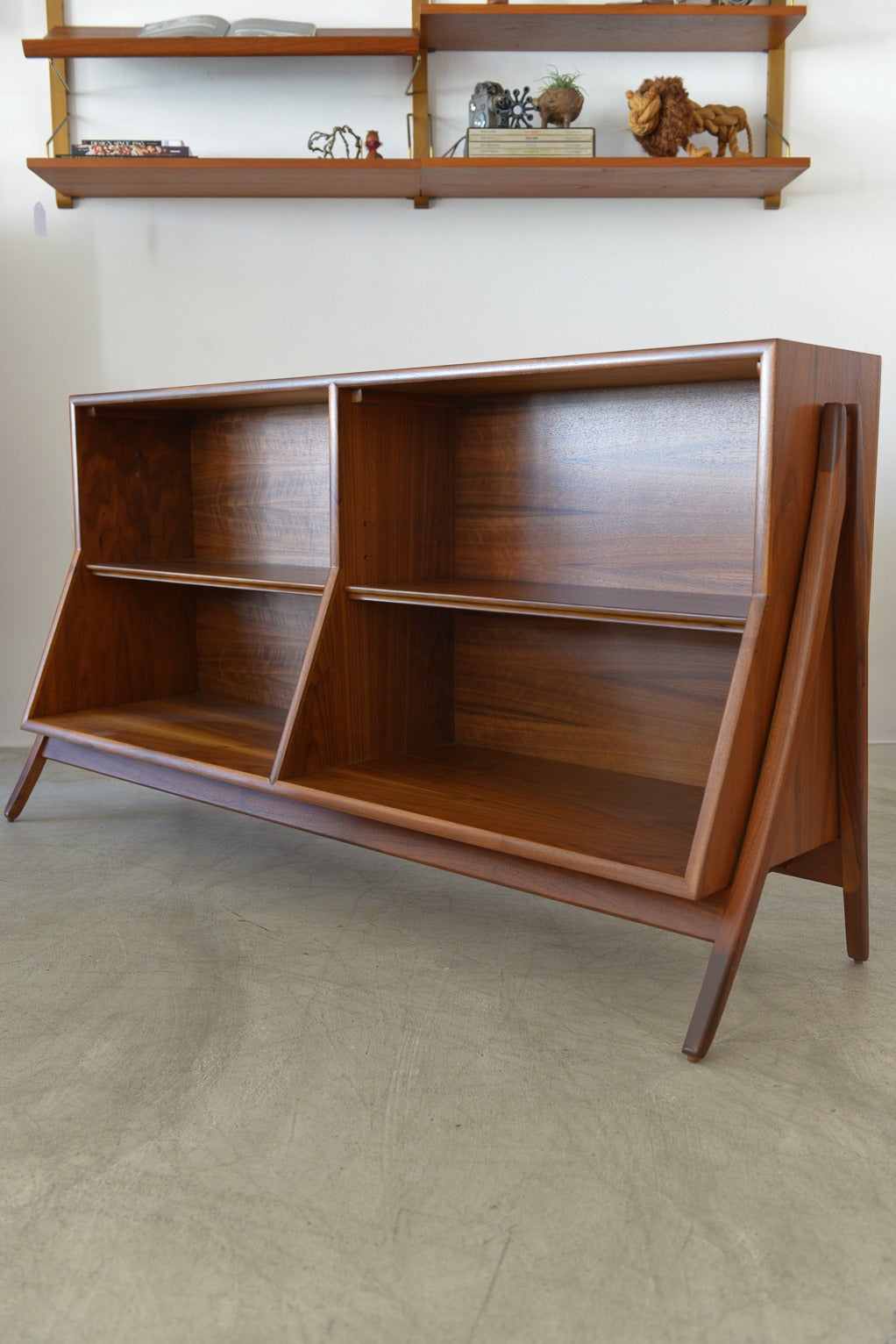 Rare walnut bookcase by Kipp Stewart and Stewart MacDougall for Drexel's Declaration line.  Professionally restored to showroom perfect condition, this rare piece is perfect for just about anywhere in your home.

Finished on both sides, it can