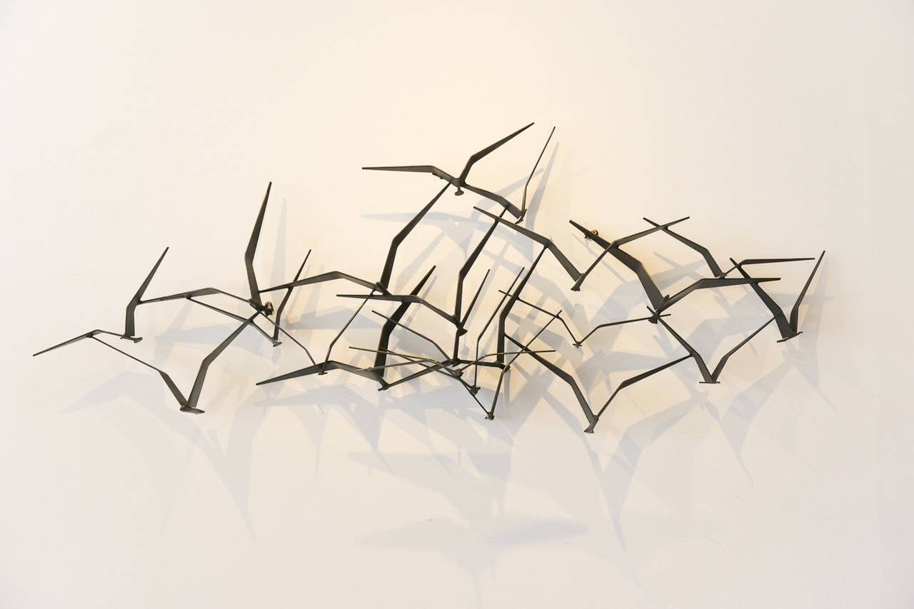 This is a beautiful and original signed 1969 C. Jere 'Birds in Flight' metal brutalist wall sculpture. Made of solid iron with sculpted birds, this piece is an iconic and classic mid century design. Incredibly popular and great looking in almost any