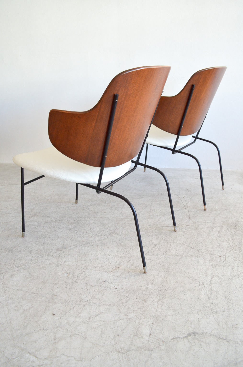 Highly desirable PAIR of Kofod-Larsen penguin lounge chairs, signed and restored to showroom condition. Bentwood back made in Denmark.

These are the lower and wider version of the dining chairs, more desirable and harder to find. Professionally