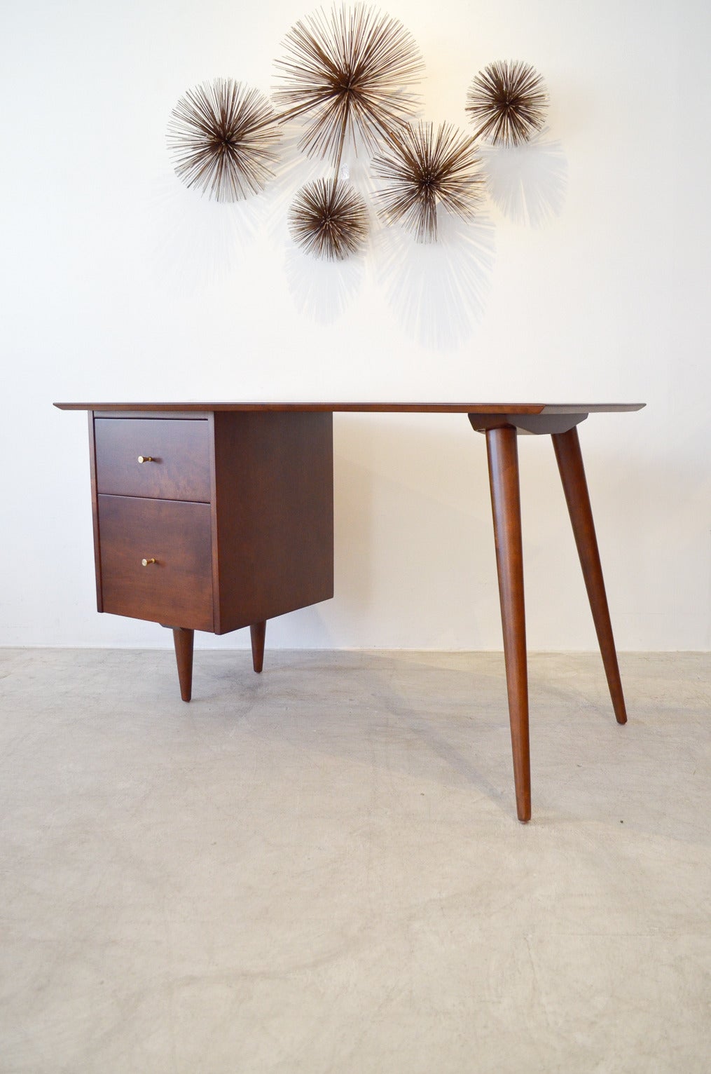 This Planner Group desk is Classic, iconic, simple. Amazing design describes this desk is designed by Paul McCobb for Winchendon Furniture Company. Professionally restored with walnut finish and in showroom perfect condition.

Beautiful, finish