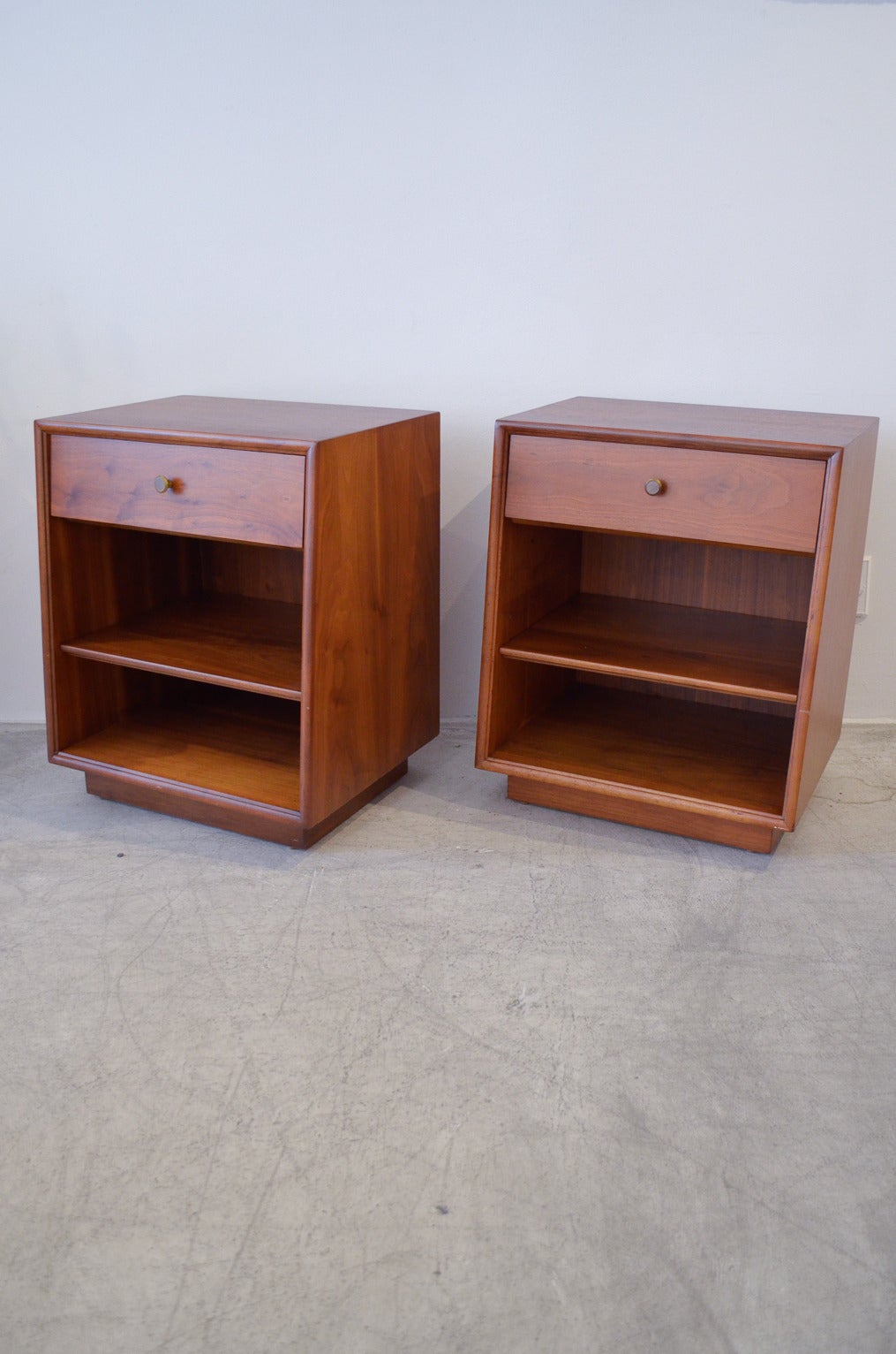 Beautiful pair of Kipp Stewart for Drexel nightstands or side tables with adjustable inner shelf, sliding drawer and original hardware. Professionally restored in showroom condition.