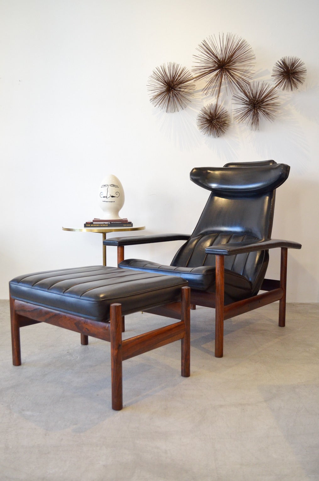 Rare rosewood lounge chair and ottoman by Sven Ivar Dysthe for Dokka Mobler of Norway. Original upholstery with channel stitching on ottoman and back of chair, rosewood frame and nice brass detailing on back and frame.

Excellent vintage