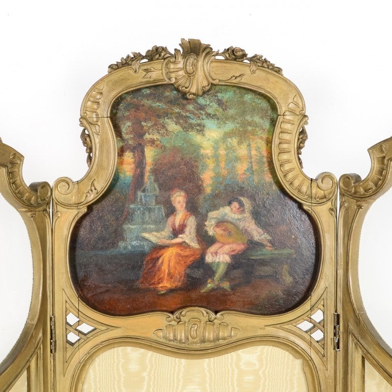 Early 20th century French dressing screen in the Louis-XV style. Beautiful, flowing, curvilinear lines and hand painted panel. Original condition.