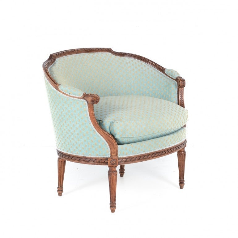 A French Elegant Marquise Chair. This is a ‘French’ hostess chair named ‘marquise’ for the lady of the house to host in the living room. This lovely carved piece is from the early 20th Century and the upholstery is in excellent condition.