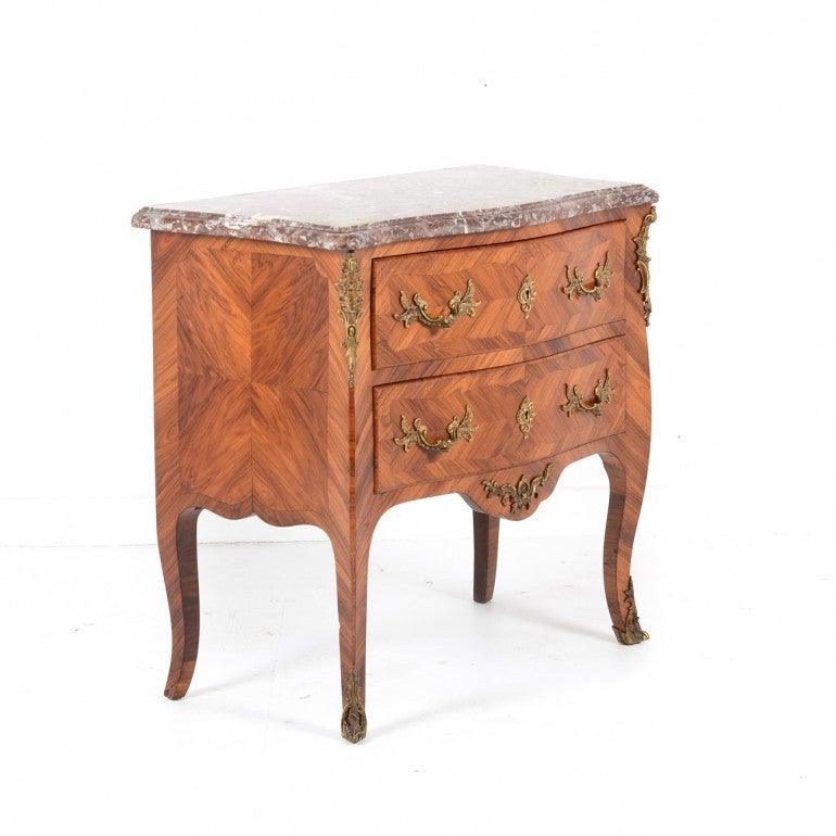 Exceptional quality small scaled French commode with beautiful marquetry with finely detailed bronze mounts and pulls. Detailed, crisp and beautifully executed, early 20th Century. Perfect for night table or anywhere where an elegant fine smaller