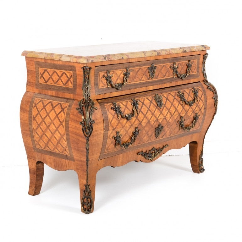 Late 19th century fine French antique ‘transitional’ commode from France. Constructed of exotic wood veneers over solid core with finely detailed bronze mounts and pulls. Original condition with Brescia marble top. No breaks or chips in the marble.
