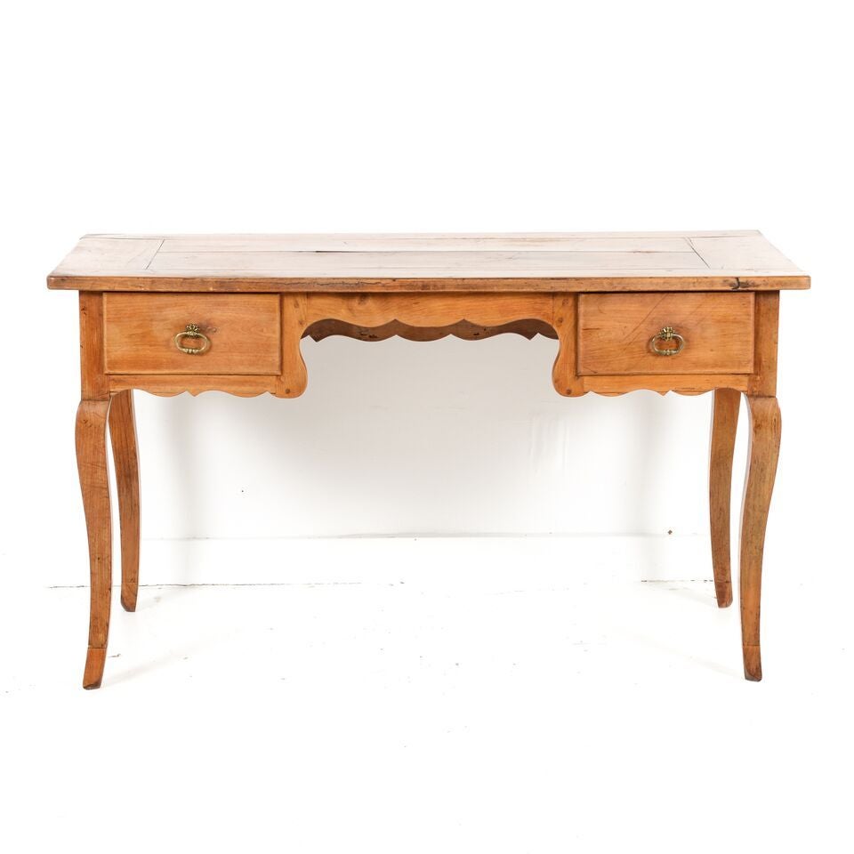 Antique French country desk circa 1860 of solid fruitwood, from the South of France. Lovely age and wear on this highly decorative and functional piece. 51″ Wide x 25″ Deep x 29″ Tall.